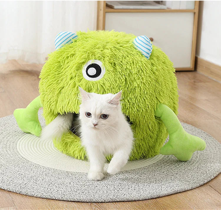 Fluffy round pet bed for cats and small dogs on a wooden floor