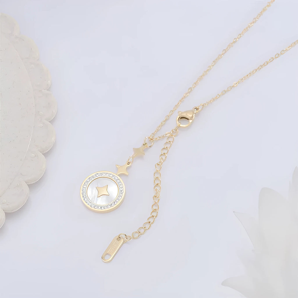 Close-up of a hexagonal six-pointed star titanium steel pendant necklace on a gold O-ring chain.