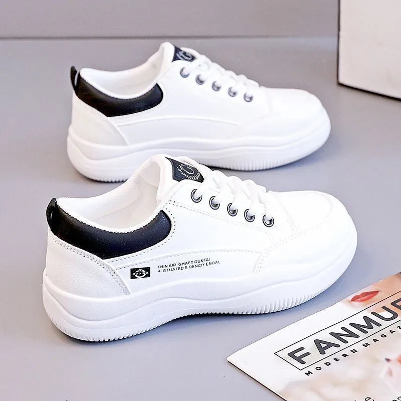 Women's white Korean-style low-top lace-up pumps with cross straps and a round toe.