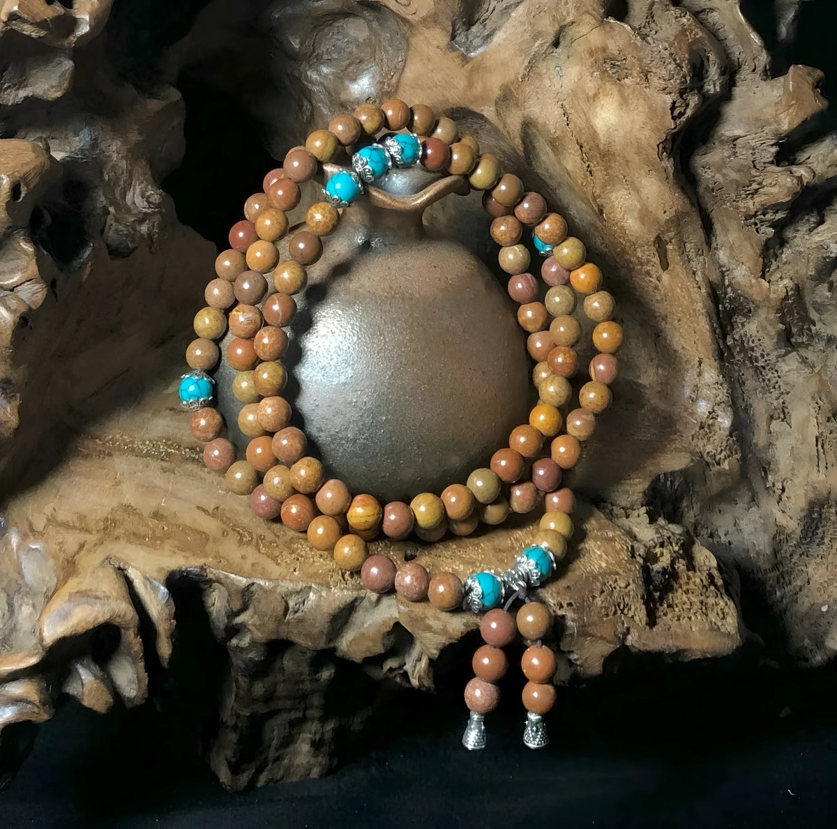 Stone bracelet with 108 geometric beads showing hand-polished finish