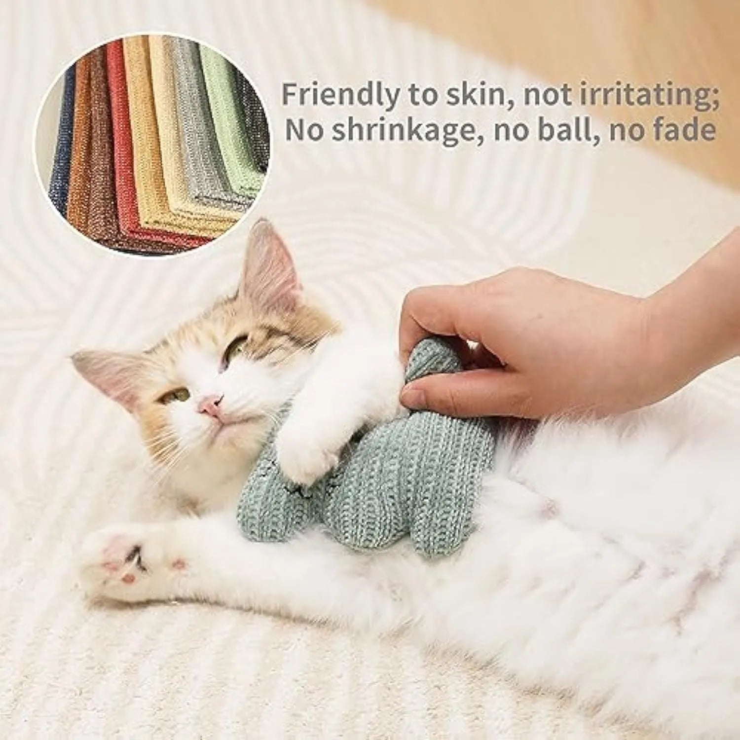 Cyan knitted plush cat toy with rope sections, containing catnip and a bell, shown on a white background.