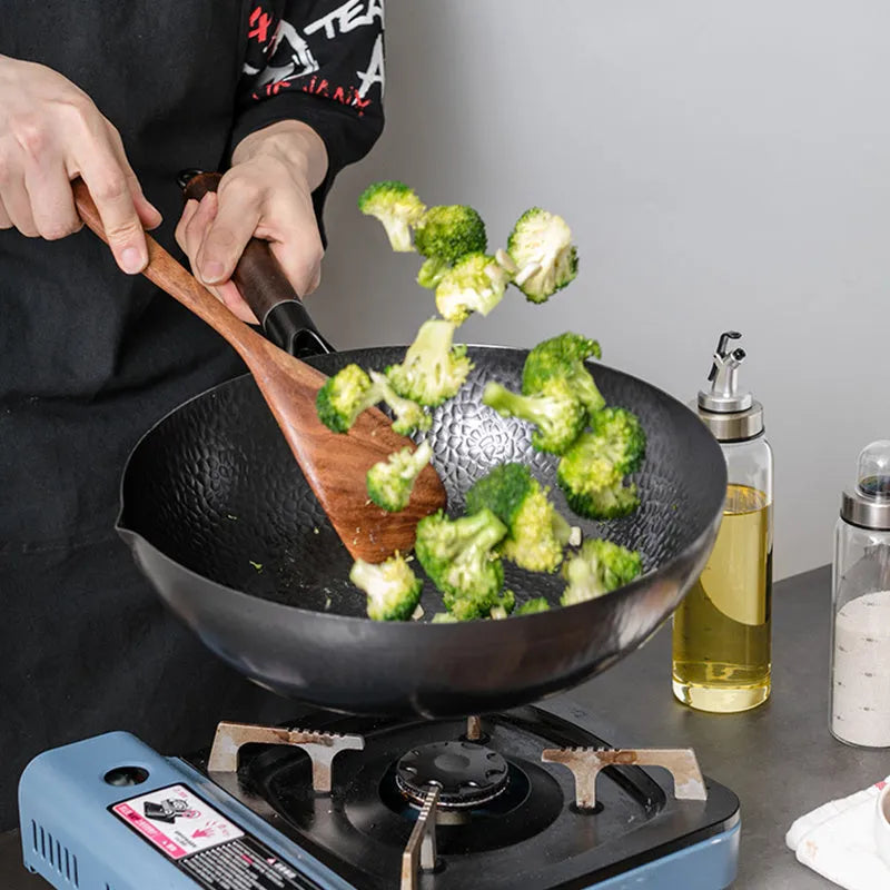 Traditional black iron wok with wooden handle, 40cm diameter.