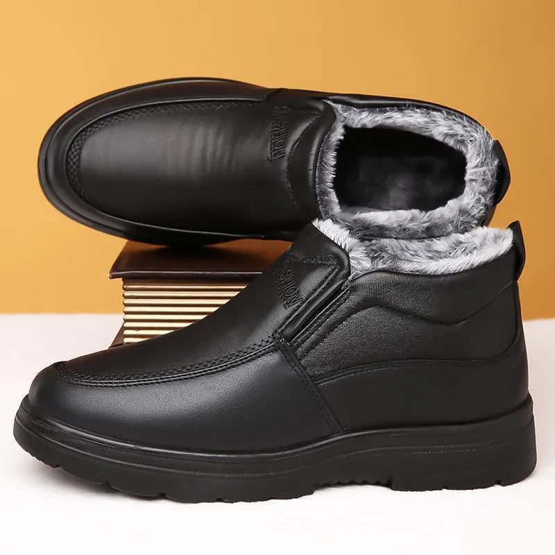Men's black casual winter slip-on shoes with a waterproof PU upper and thick rubber sole.