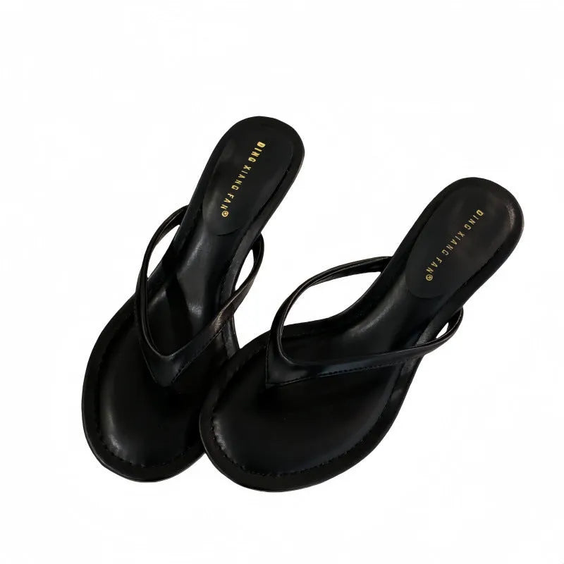 Women's round toe stiletto flip-flop sandals in black and camel colours on a rubber sole.