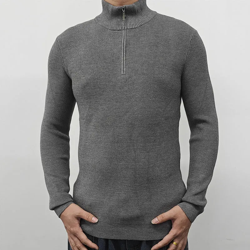 Men's grey half-turtleneck zip-up sweater on a hanger, showing front zip and long sleeves.