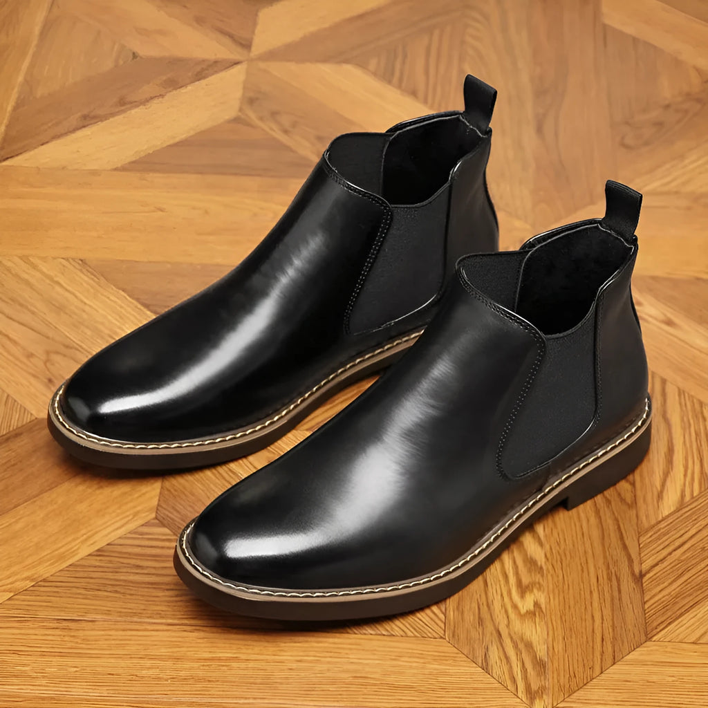 Men's black and brown formal pointed-toe leather boots with a square heel and rubber sole.