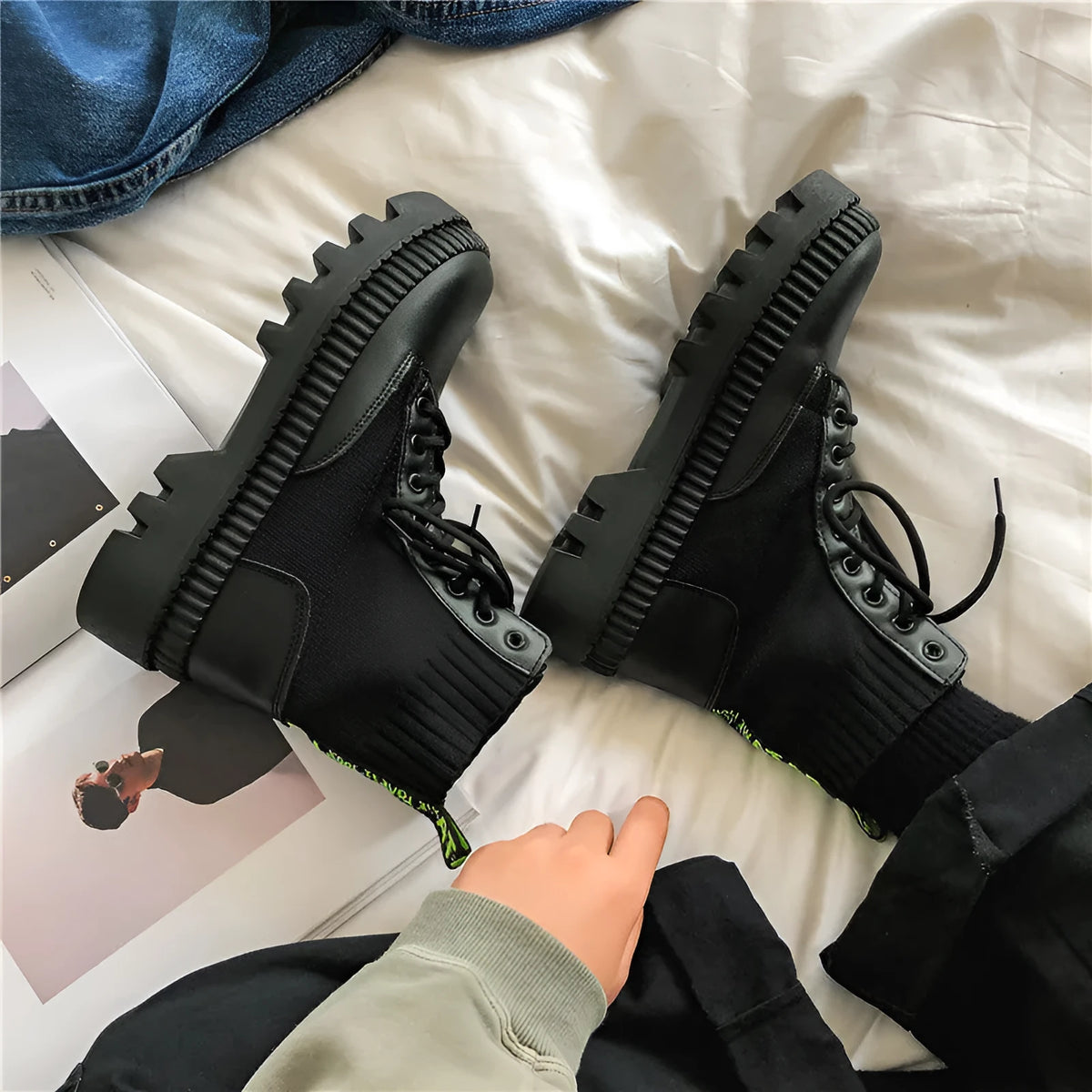 Men's black Dr Martens high-top platform boots with side zipper and textured leather.