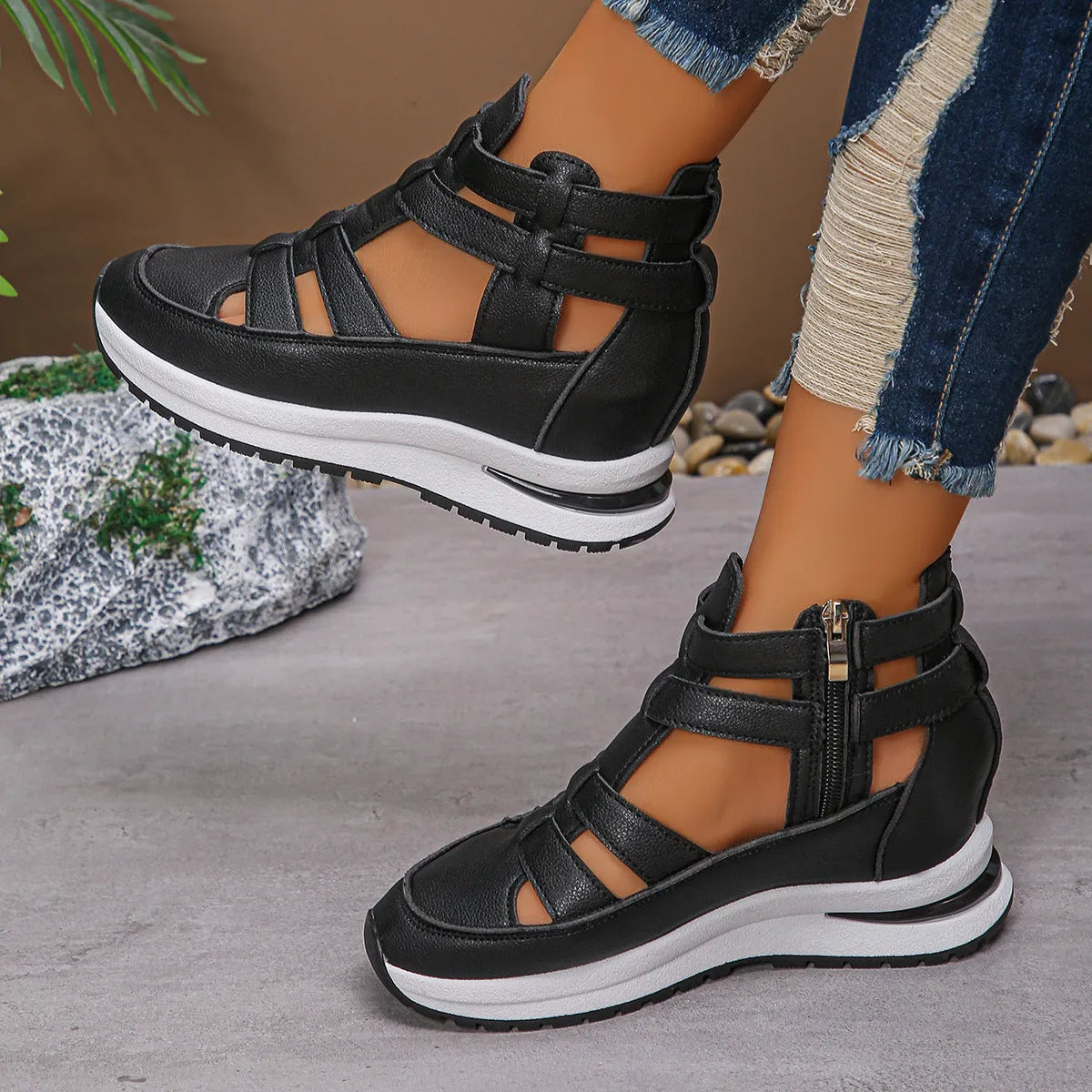 Women's black close-toed hollow-out platform sandals with Velcro strap on a white background.