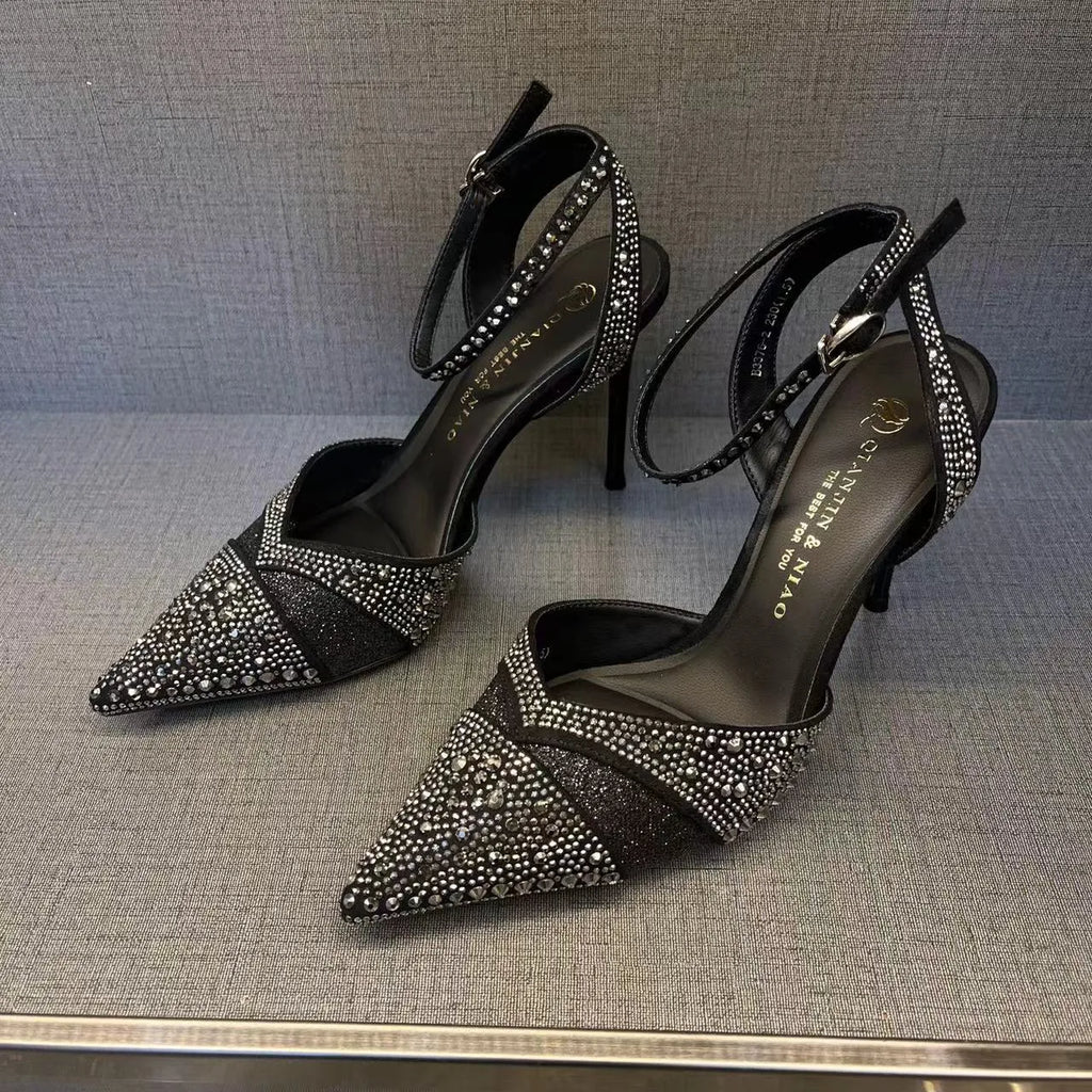 Women's black hollow high heels with red sole and pointed toe stiletto design