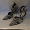 Women's black hollow high heels with red sole and pointed toe stiletto design