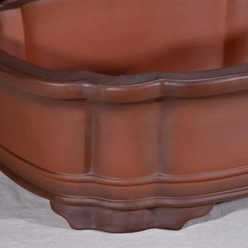 Large antique-look purple clay flowerpot with Chinese tree stump and floral patterns.