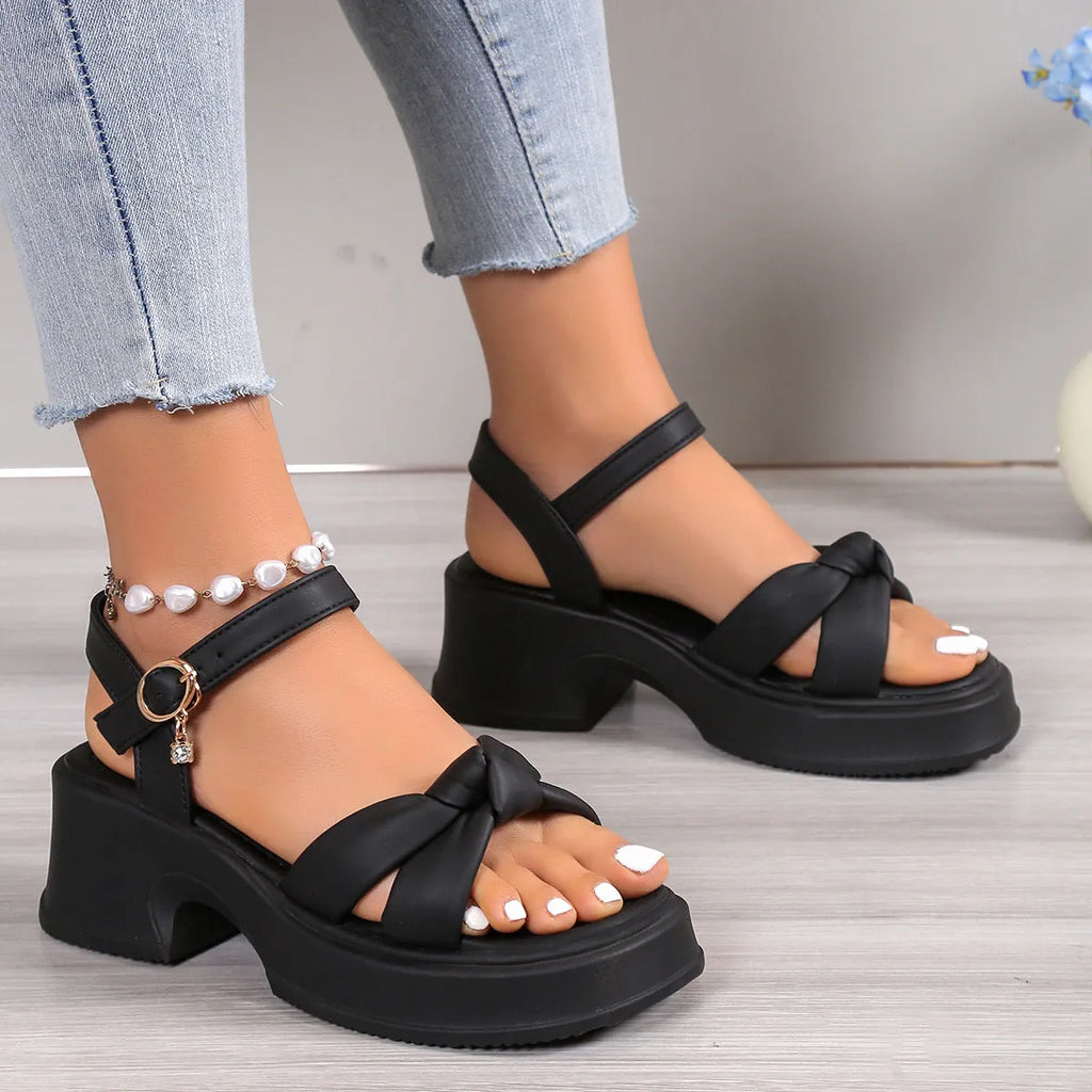 Black women's high heel slippers with thick rubber sole and round toe.