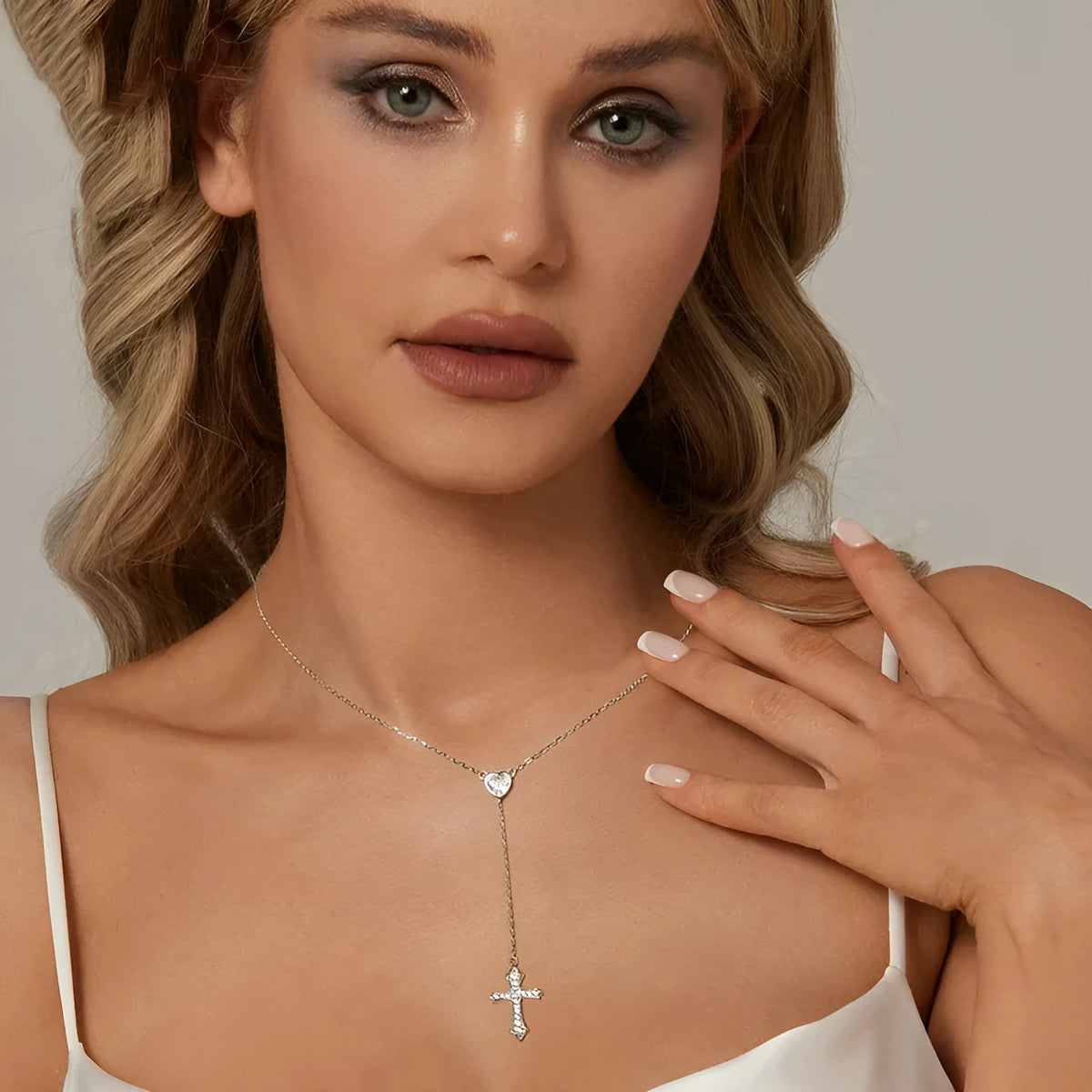 Silver V-neck Love Cross pendant on an O-ring chain necklace for women.