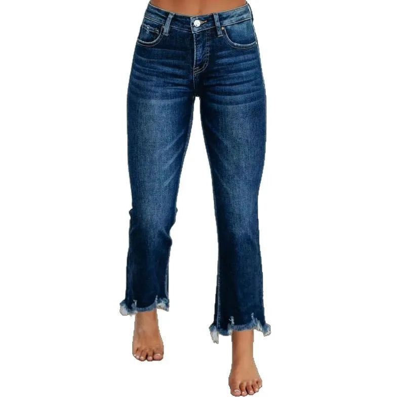 Women's dark blue casual denim jeans with hand-worn distressing on a solid cotton fabric