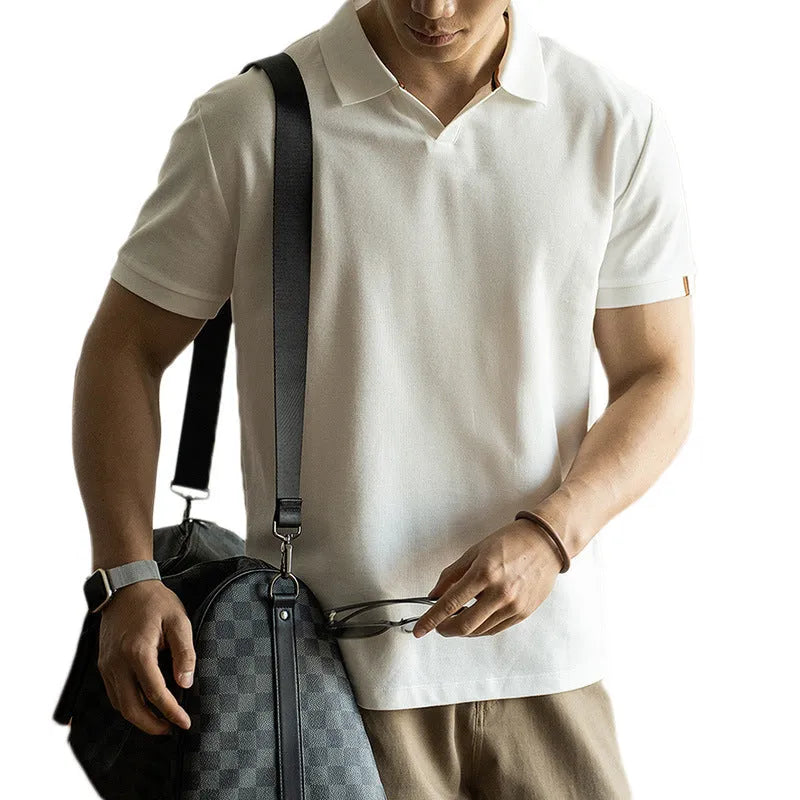 Blue short-sleeved casual polo shirt on a hanger showing the collar and button placket.