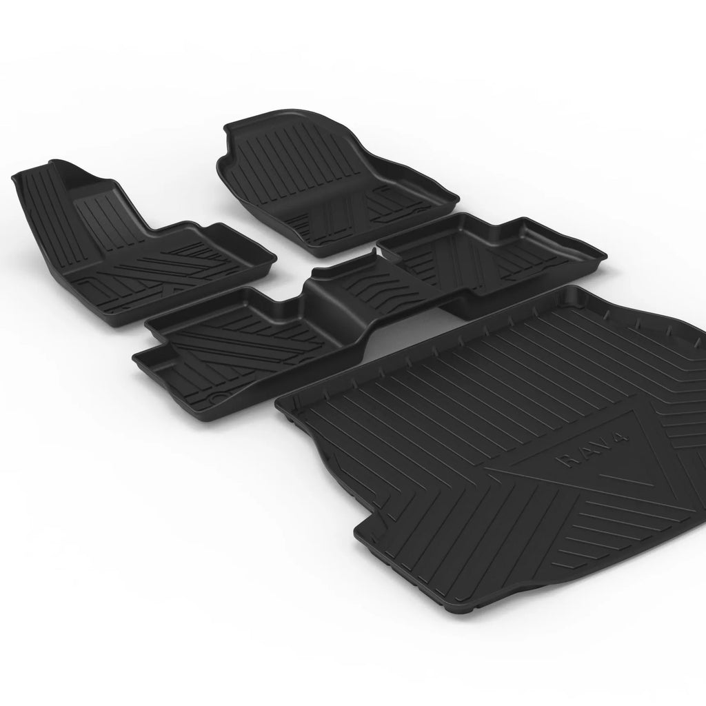 Black TPE car boot liner with carbon fibre pattern texture, shown fitted in a vehicle trunk.