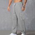 Men's corduroy cargo trousers in loose-fitting wide-leg design with drawstring waist
