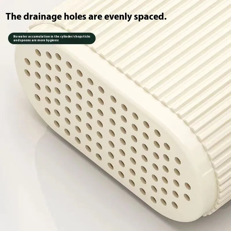 A beige plastic wall-mounted chopsticks holder with a cross-border drain design for kitchen utensil storage.