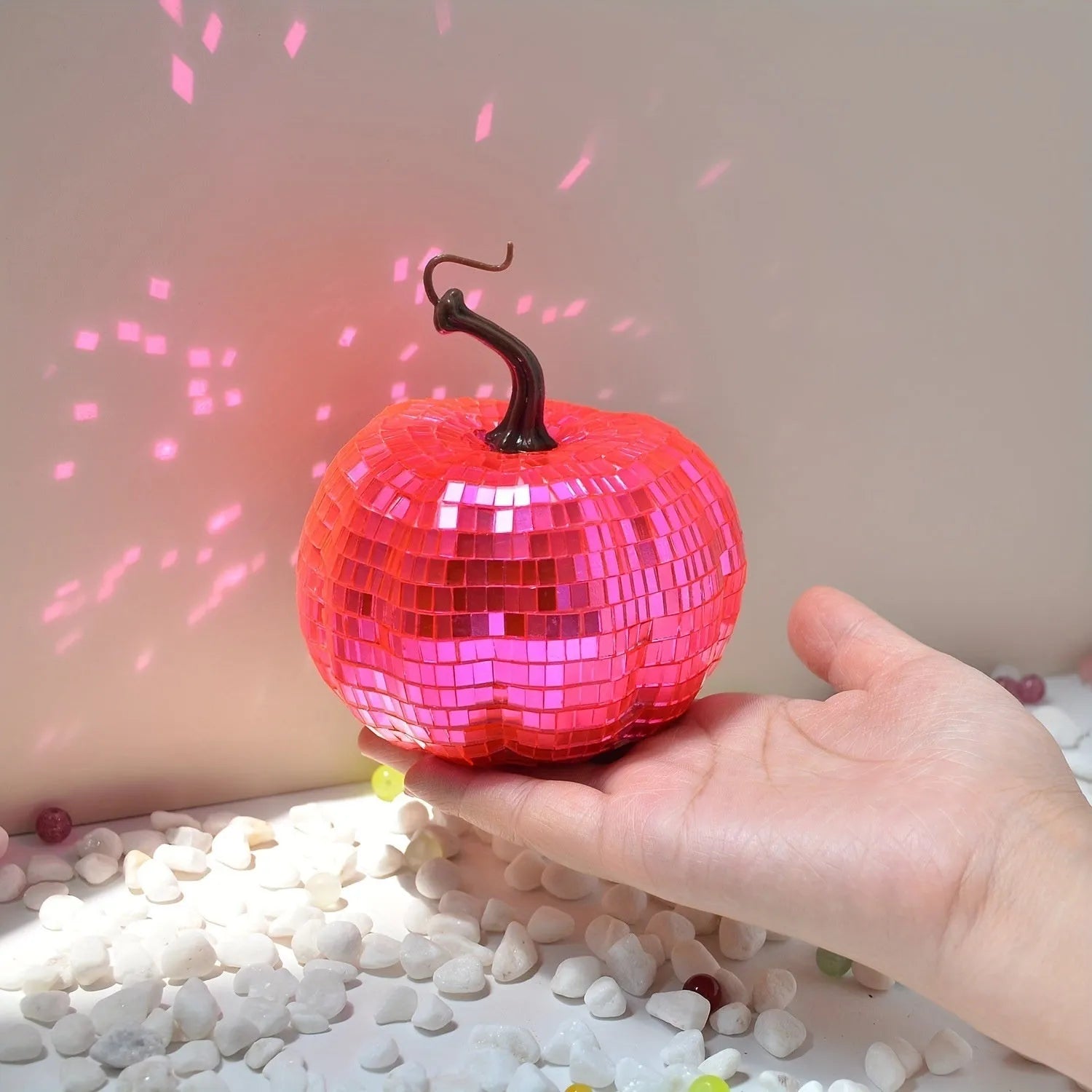 Handcrafted glass pumpkin ornament with embossed detail for Halloween and Christmas decoration.
