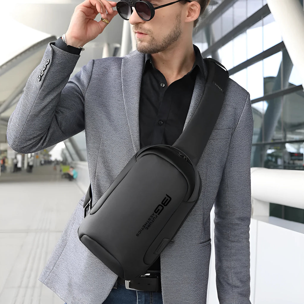 Men's black Oxford cloth shoulder bag with USB port for business travel.