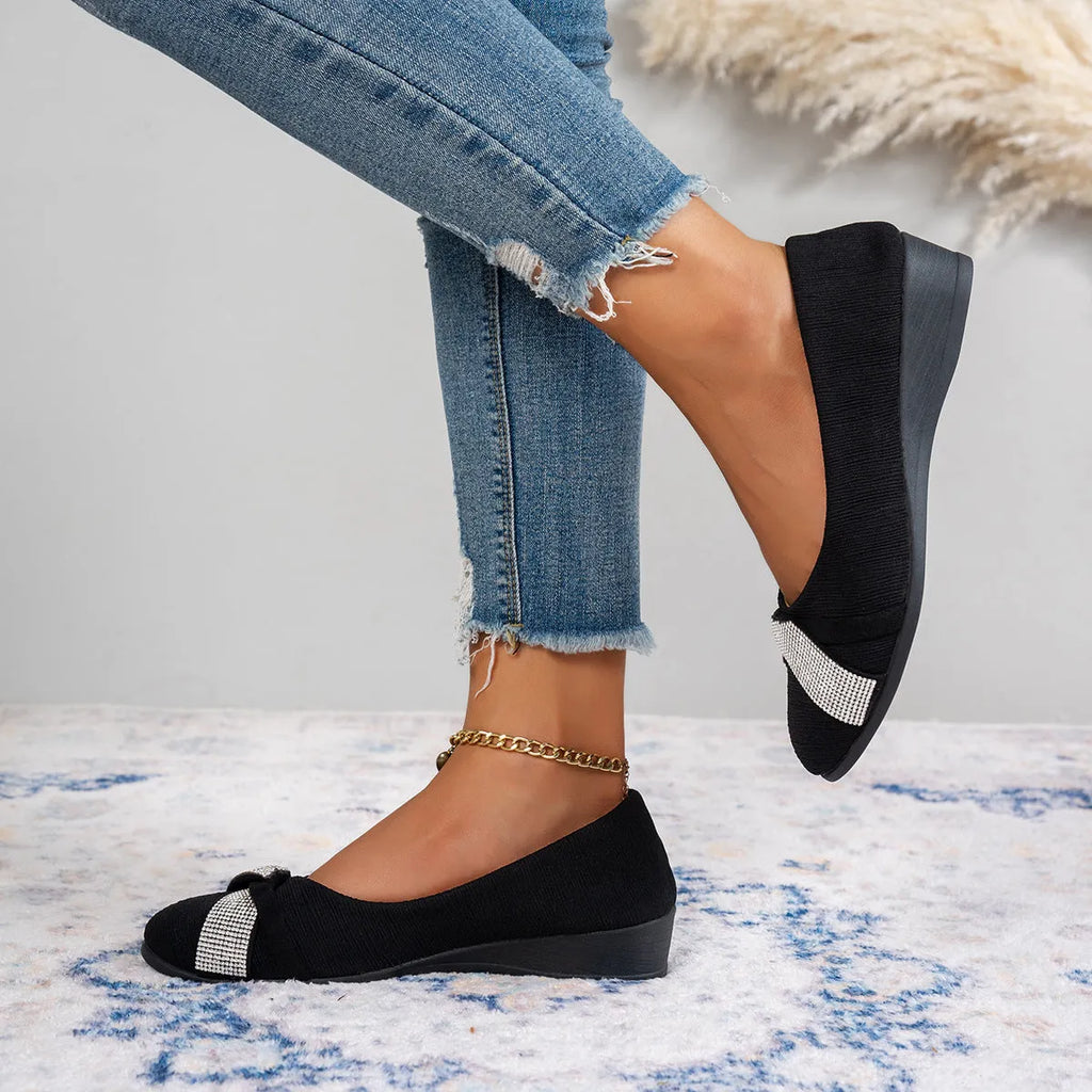 Black women's slip-on casual shoes with rhinestone detail and a chunky heel.