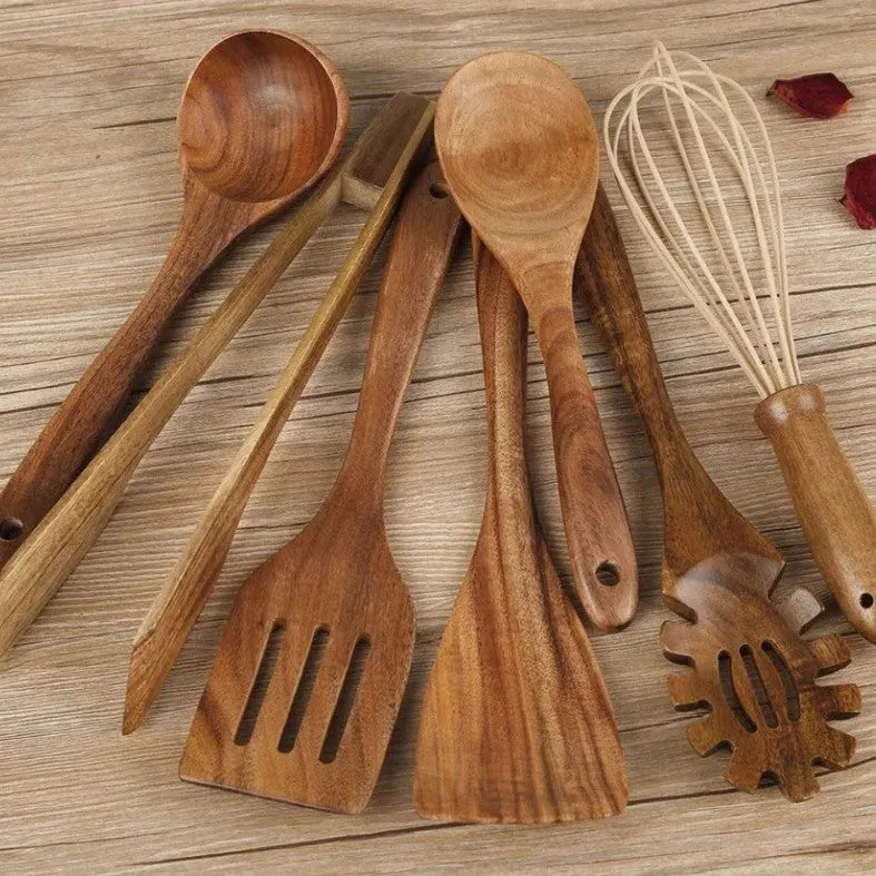 7-piece wooden cooking utensil set with natural wood finish including various spoon and spatula designs