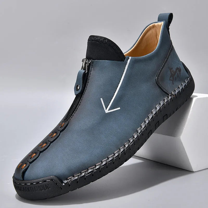 Men's black zip-up casual leather boots with round toe and hand-stitched rubber sole.