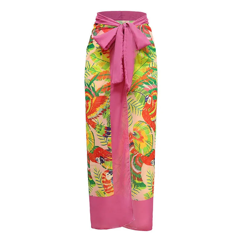 Pink floral print women's V-neck one-piece swimsuit with a thin skirt.