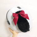Carbon fibre rabbit ears decoration for motorcycle helmets in various colours on a black background.