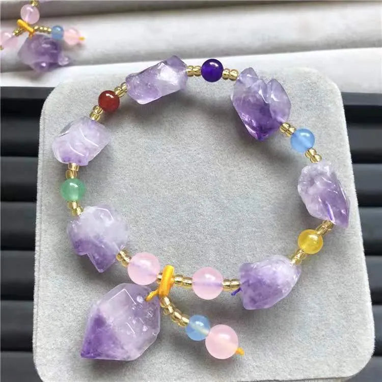Women's amethyst bead bracelet with natural-shaped stones and fu character charm on adjustable beaded design