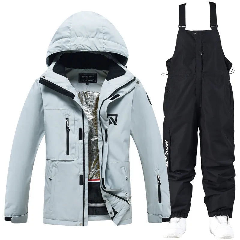 Men's and women's waterproof ski suit in blue with black trousers for winter snow sports