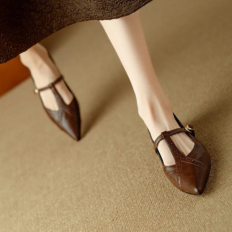 Brown pointed low-cut women's flat shoes with round toe and metal decoration on cowhide upper.