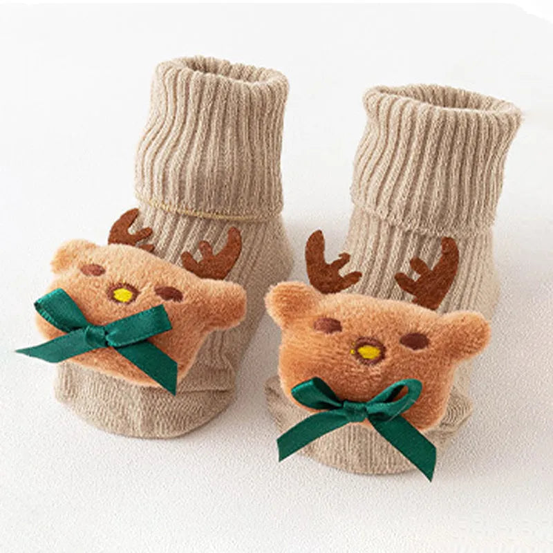 Cotton baby floor socks in a selection of colours and patterns like panda, lion, and bows, shown in sizes for infants.