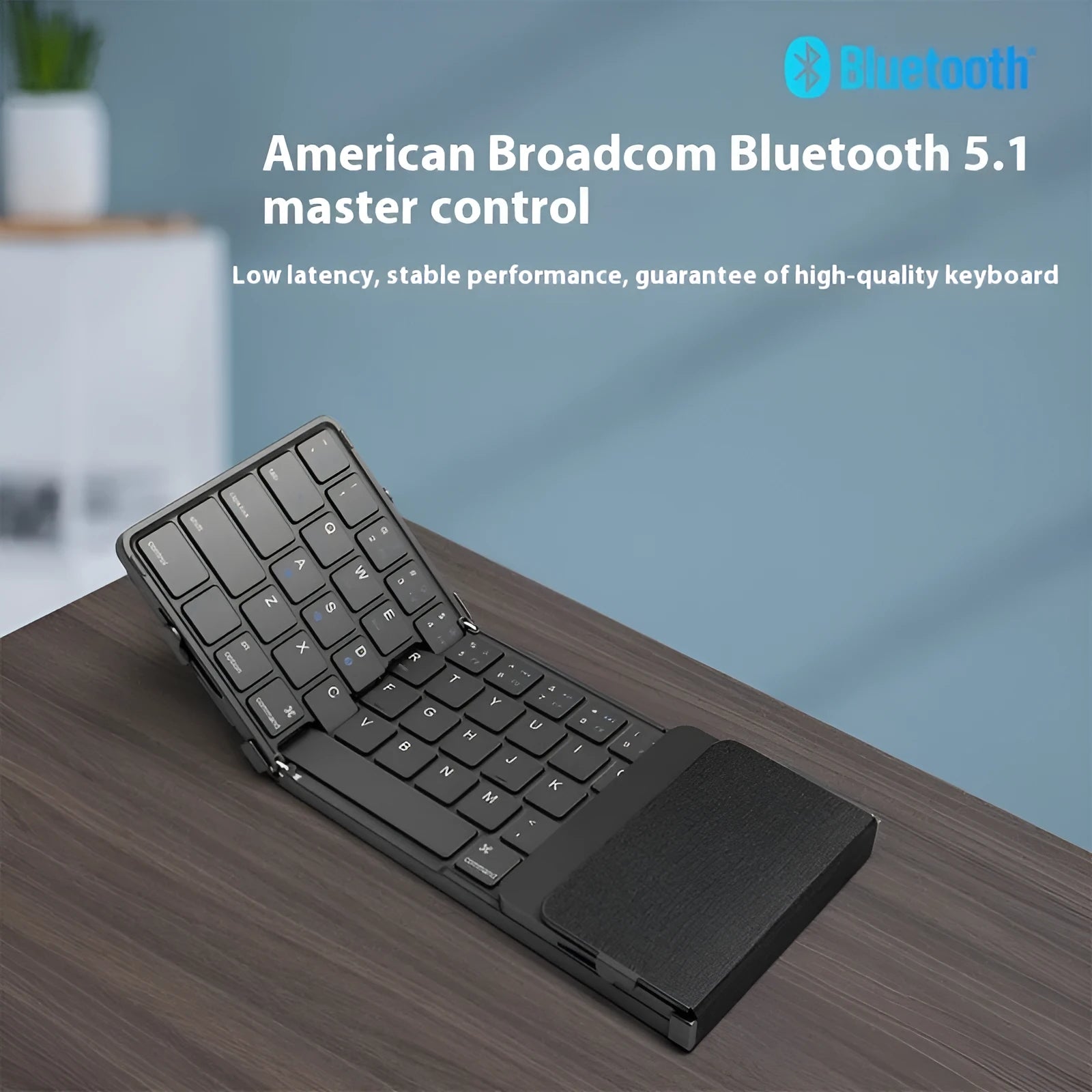 Black folding Bluetooth keyboard with touchpad for mobile phones and tablets