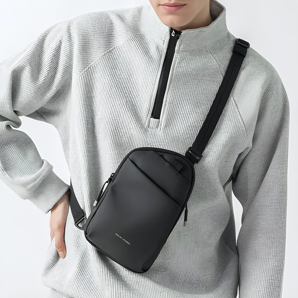 Men's elegant black Oxford cloth crossbody bag showing lightweight design and sewing thread reinforcement