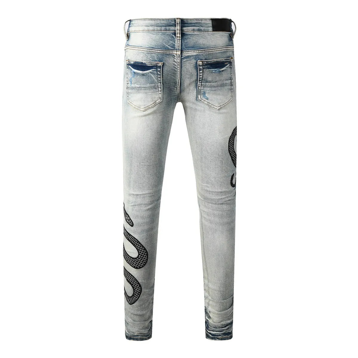 Men's blue distressed skinny jeans with wash finish showing button fly and slim fit
