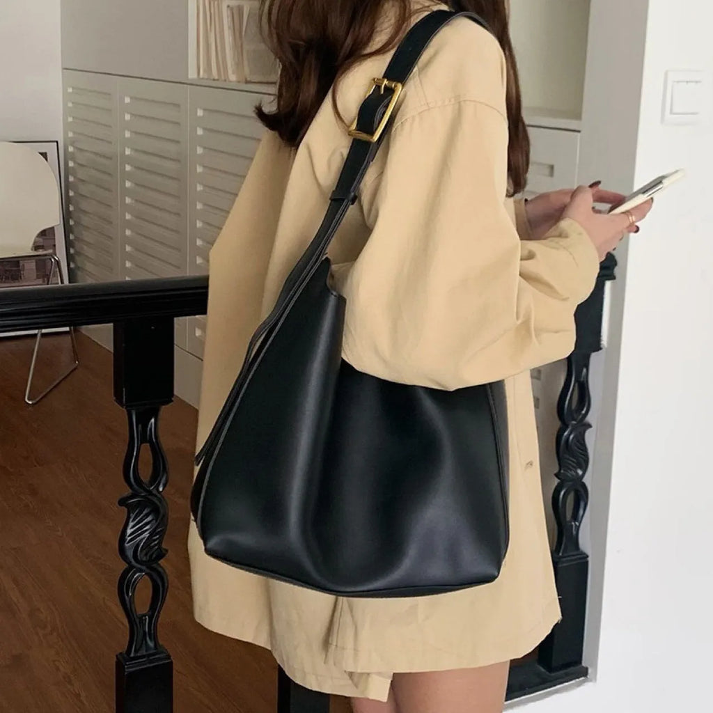 Women's soft PU shoulder bag with swing thread detail in black or brown colour