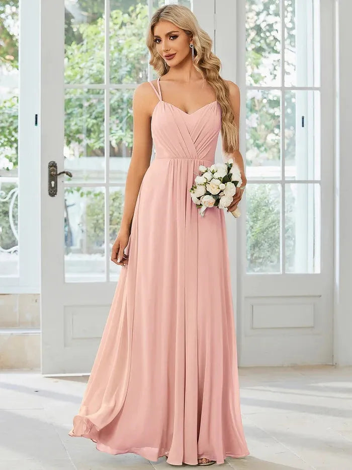 Sleeveless sling neckline banquet dress with long pleated A-line skirt in light green colour