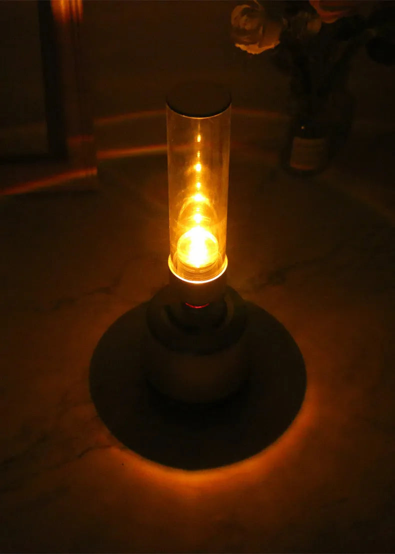 White silver Bluetooth speaker with candlelight-style night light function