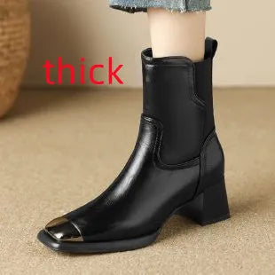 Women's brown cowhide Martin boots with high heel and side zipper, featuring decorative metal elements