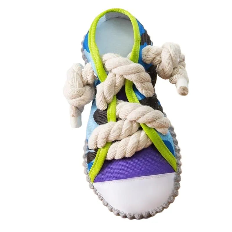Realistic shoe-shaped dog toy in grey, purple, or yellow with laces, sole patterns, built-in squeaker and bell.