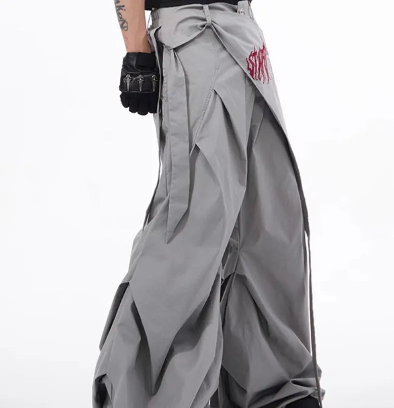 Boy wearing black wide-leg trousers in a refined Korean style, showcasing a casual and trendy look.