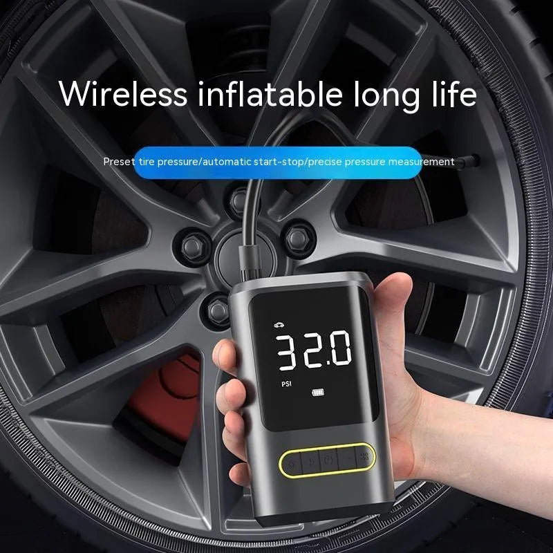 Handheld wireless digital display car air pump with LED light, hose, and multiple nozzles on black background