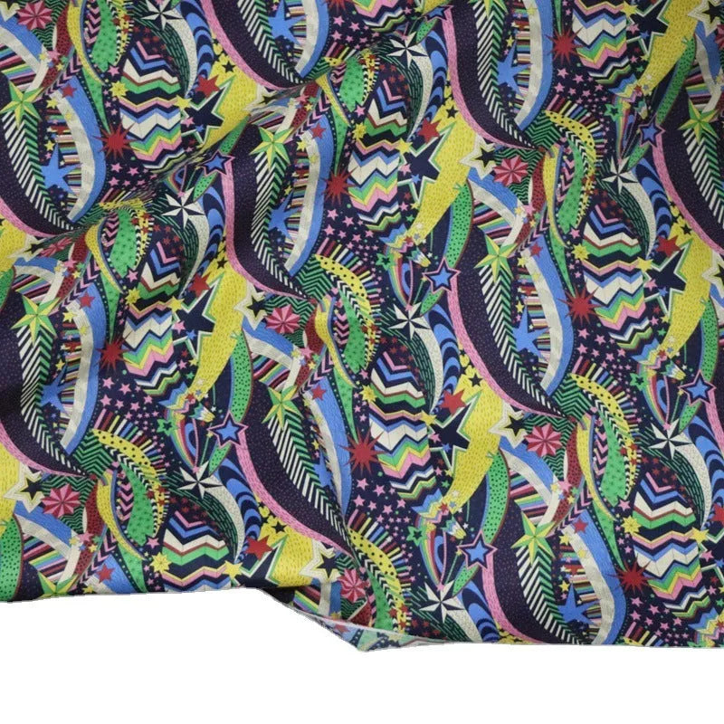 Blue cotton fabric with digital print of plants and flowers, showing 145cm width.