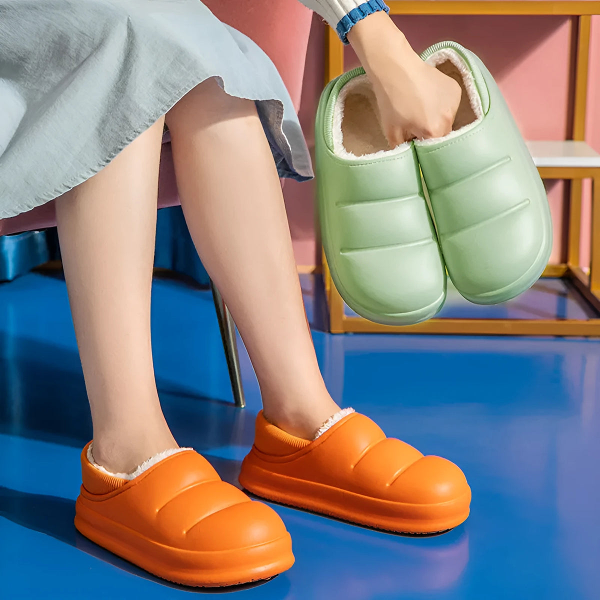 Waterproof EVA garden slippers in green with a plush lining and non-slip sole.