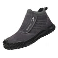 Lightweight welder labour protection shoes with steel toe cap in sand colour on a workbench.