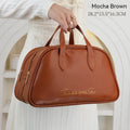 Leather travel toiletry bag open, showing interior compartments and dry-wet separation, in caramel mocha colour.