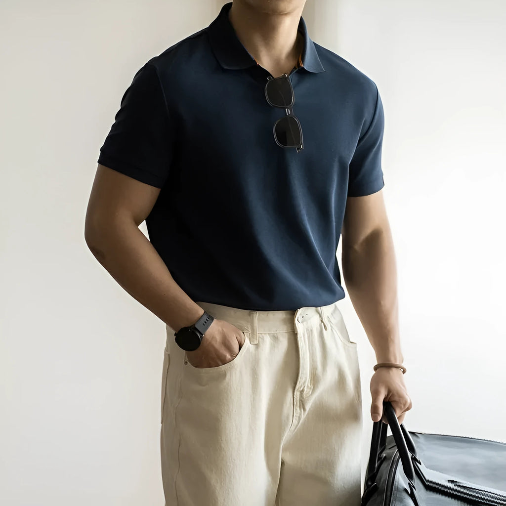 Blue short-sleeved casual polo shirt on a hanger showing the collar and button placket.