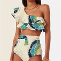 White women's one-shoulder swimsuit with large lotus leaf design and side split