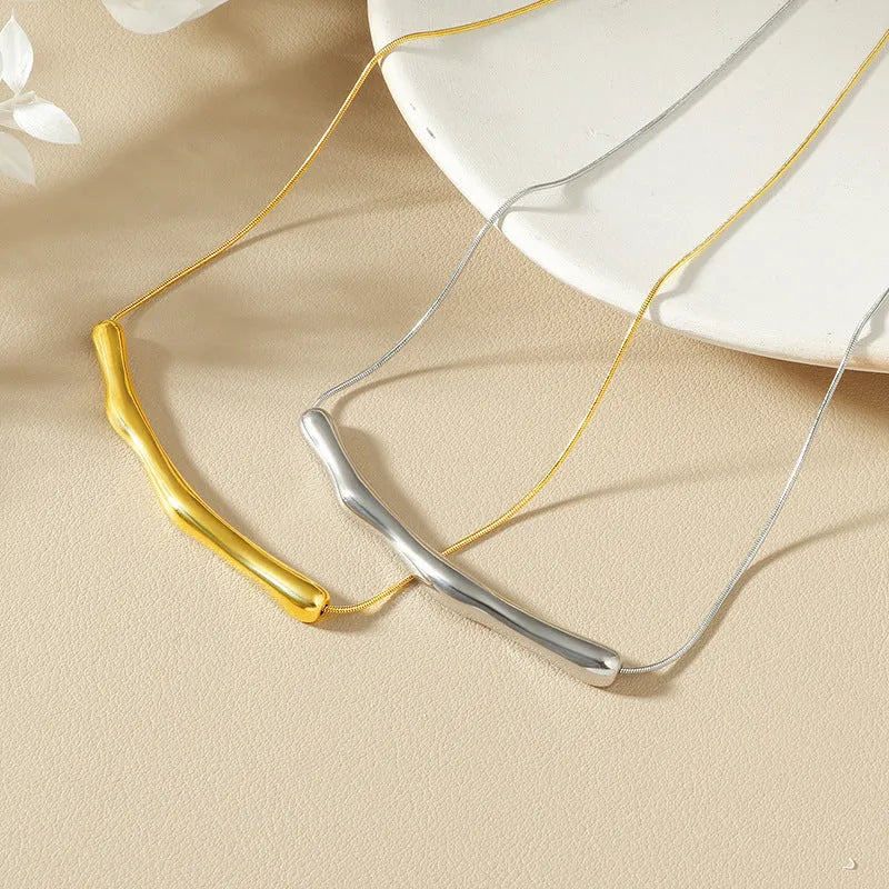Women's titanium steel necklace with irregular pleating detail in gold or steel electroplated finish.